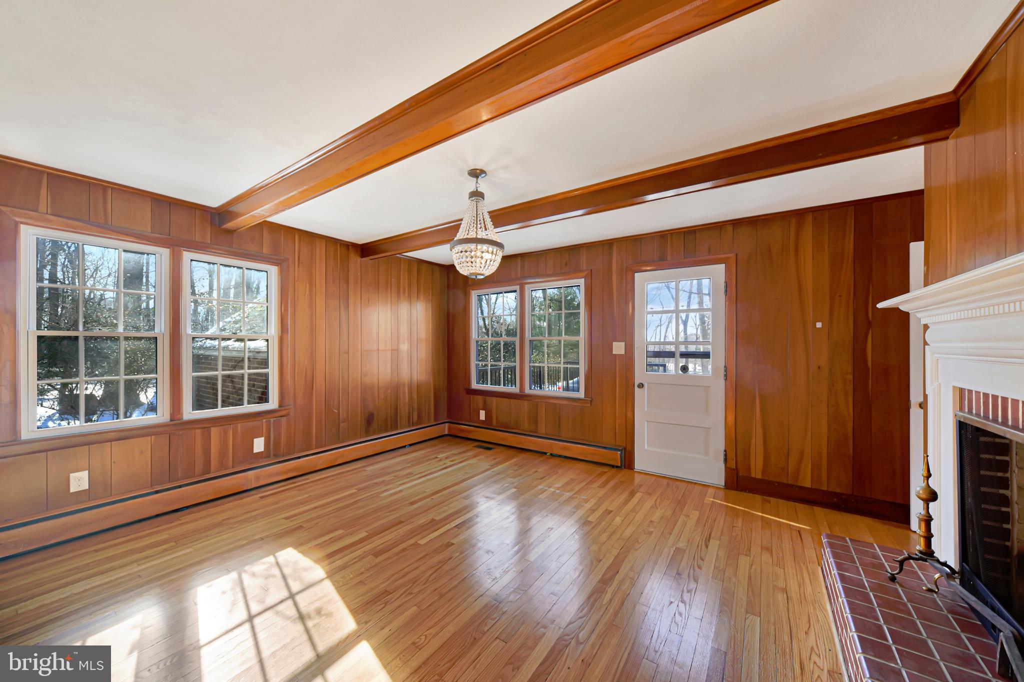 2675 Jolly Acres Road White Hall, MD 21161 - Photo 13 of 50 a view of an empty room with wooden floor and a window