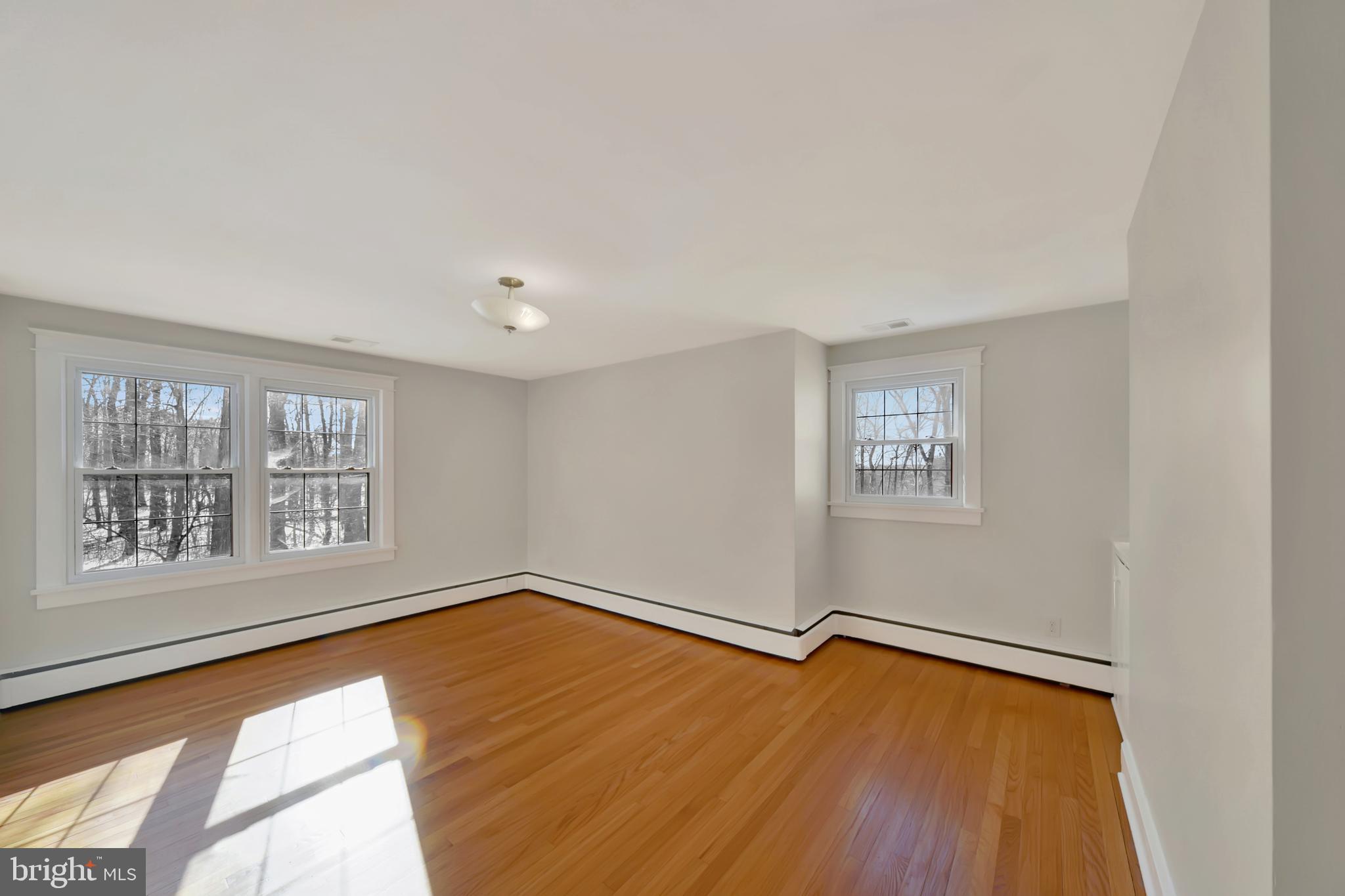 2675 Jolly Acres Road White Hall, MD 21161 - Photo 19 of 50 a view of empty room with wooden floor and fan