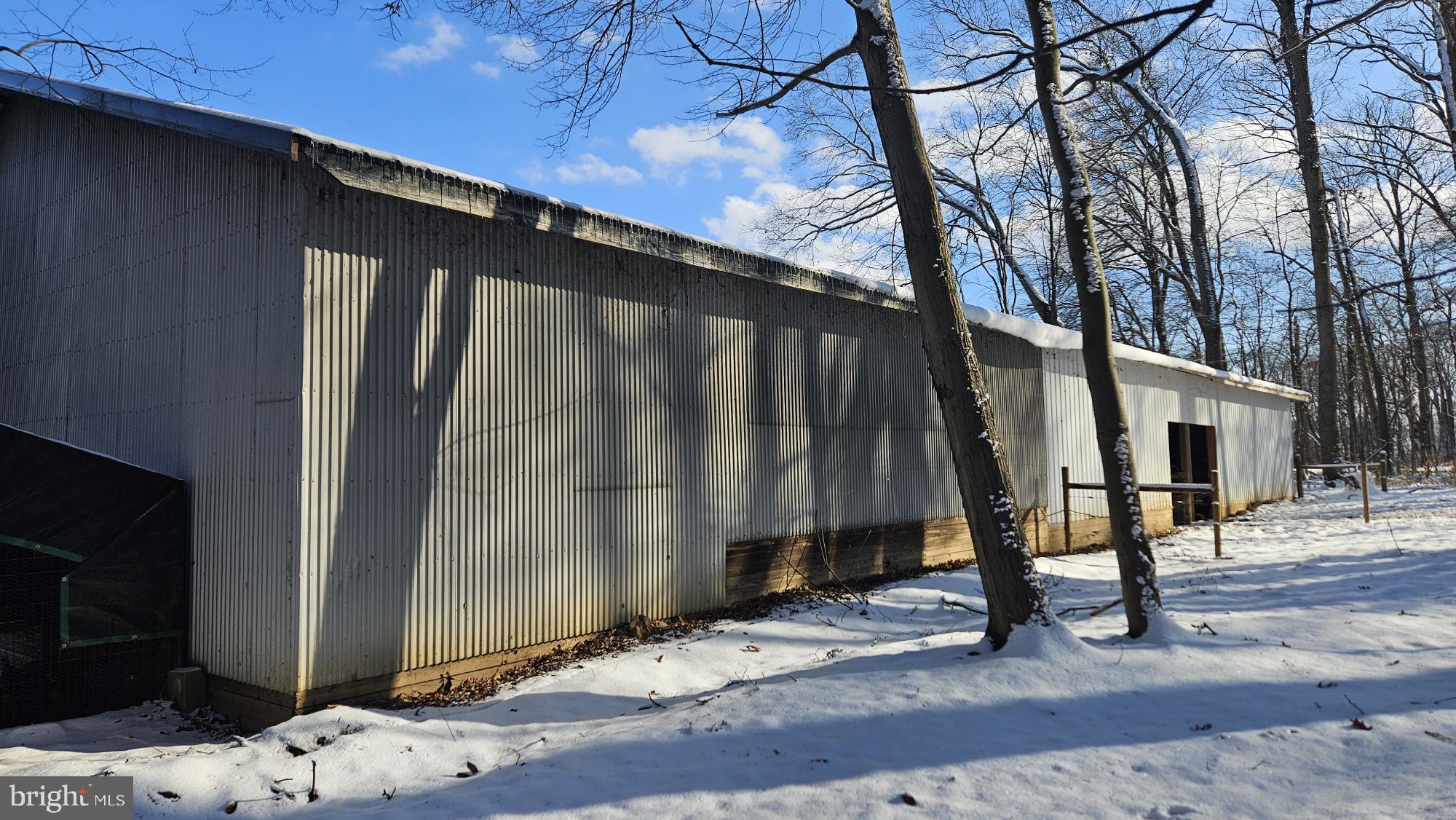 2675 Jolly Acres Road White Hall, MD 21161 - Photo 20 of 20 Rear View of Metal Pole Barn with fenced woodlot