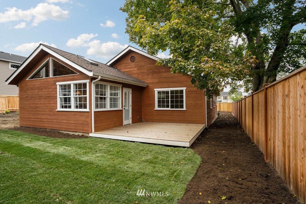 904 232nd Street Southeast, Unit 5 Bothell, WA 98021 - Photo 22 of 25 a front view of a house with a yard