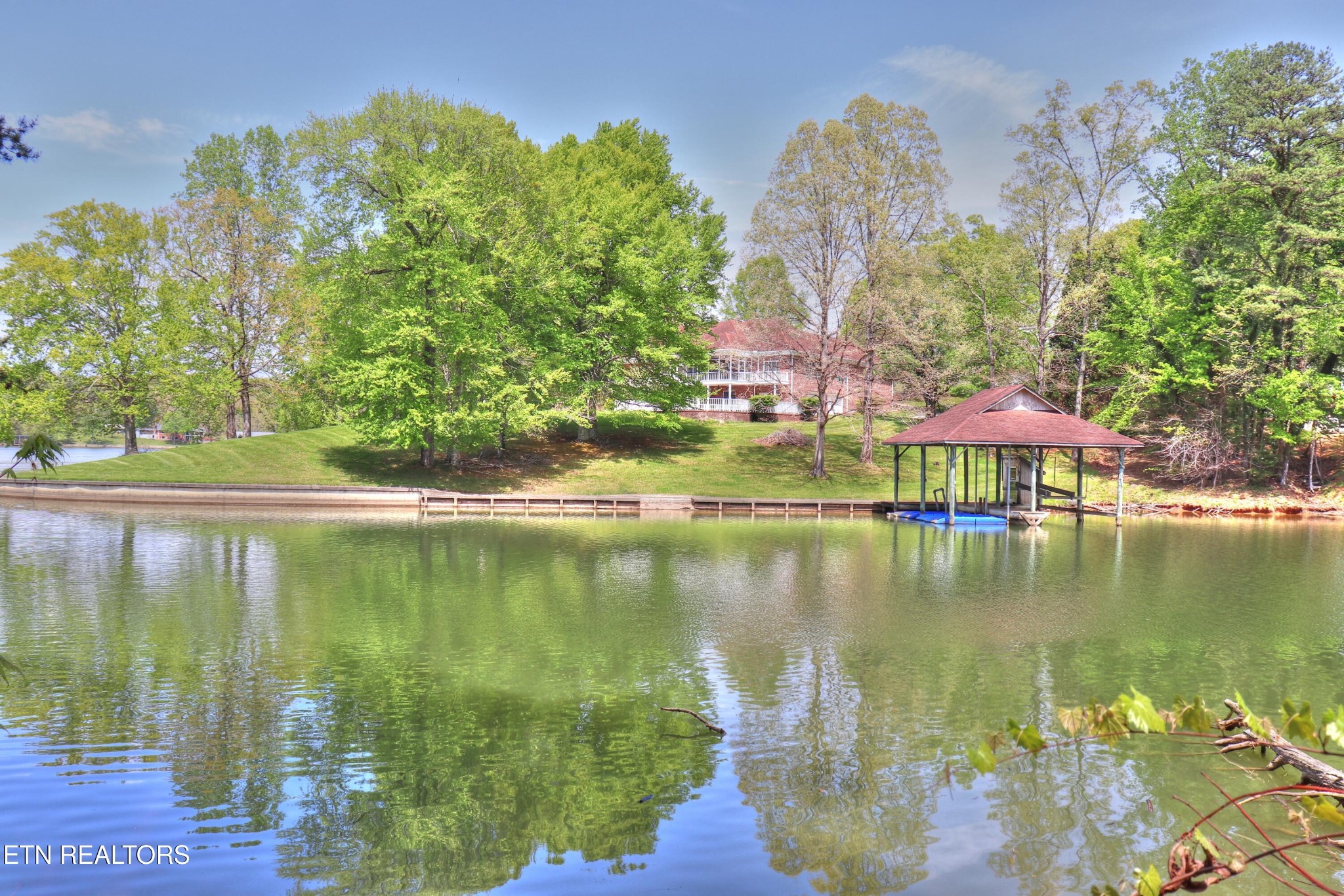 8 Spring Crossing Drive Spring City, TN 37381 - Photo 4 of 13 a view of a lake with a building in the background