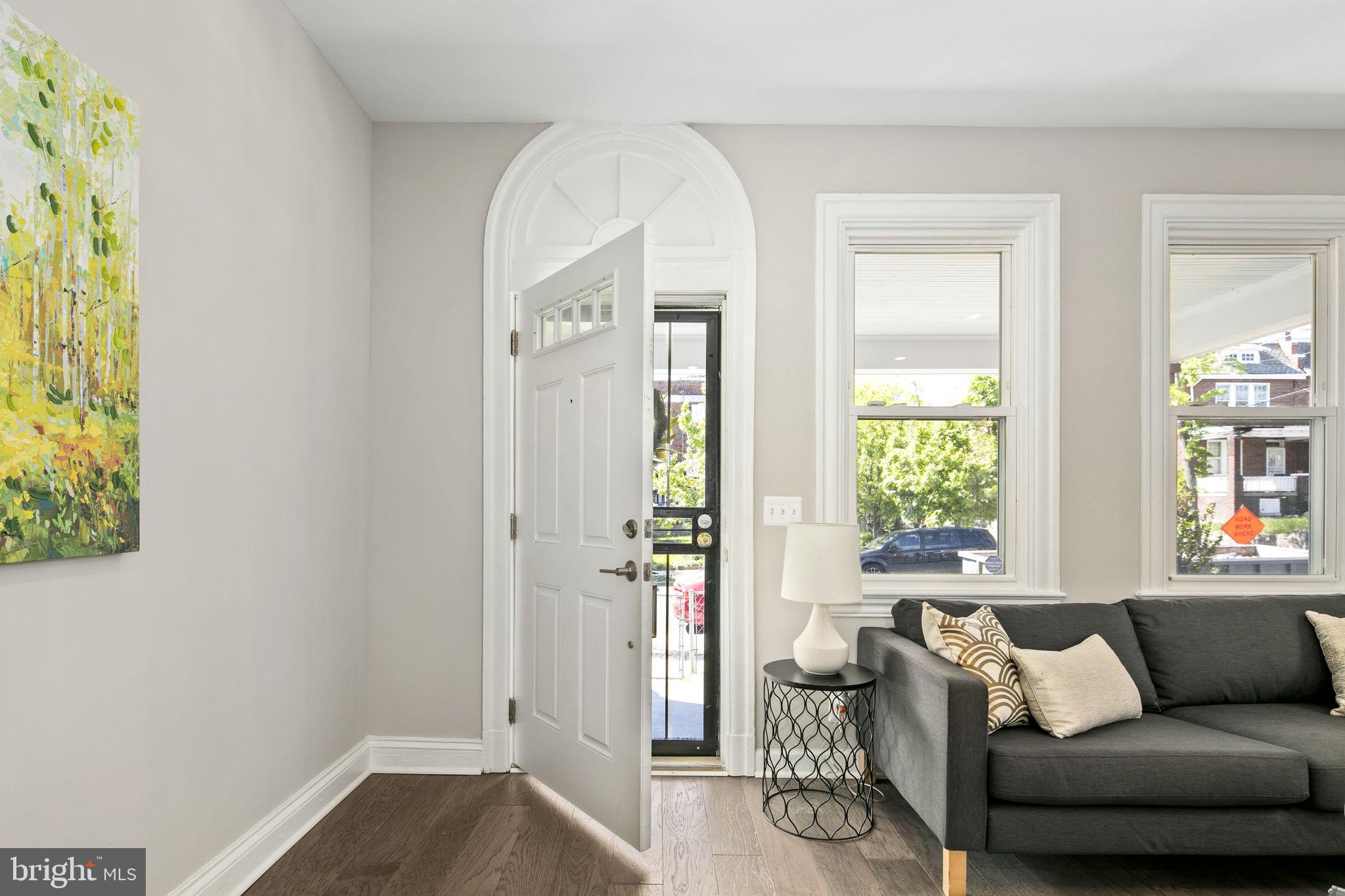 713 Rittenhouse Street Northwest Washington, DC 20011 - Photo 12 of 35 a living room with furniture and a window