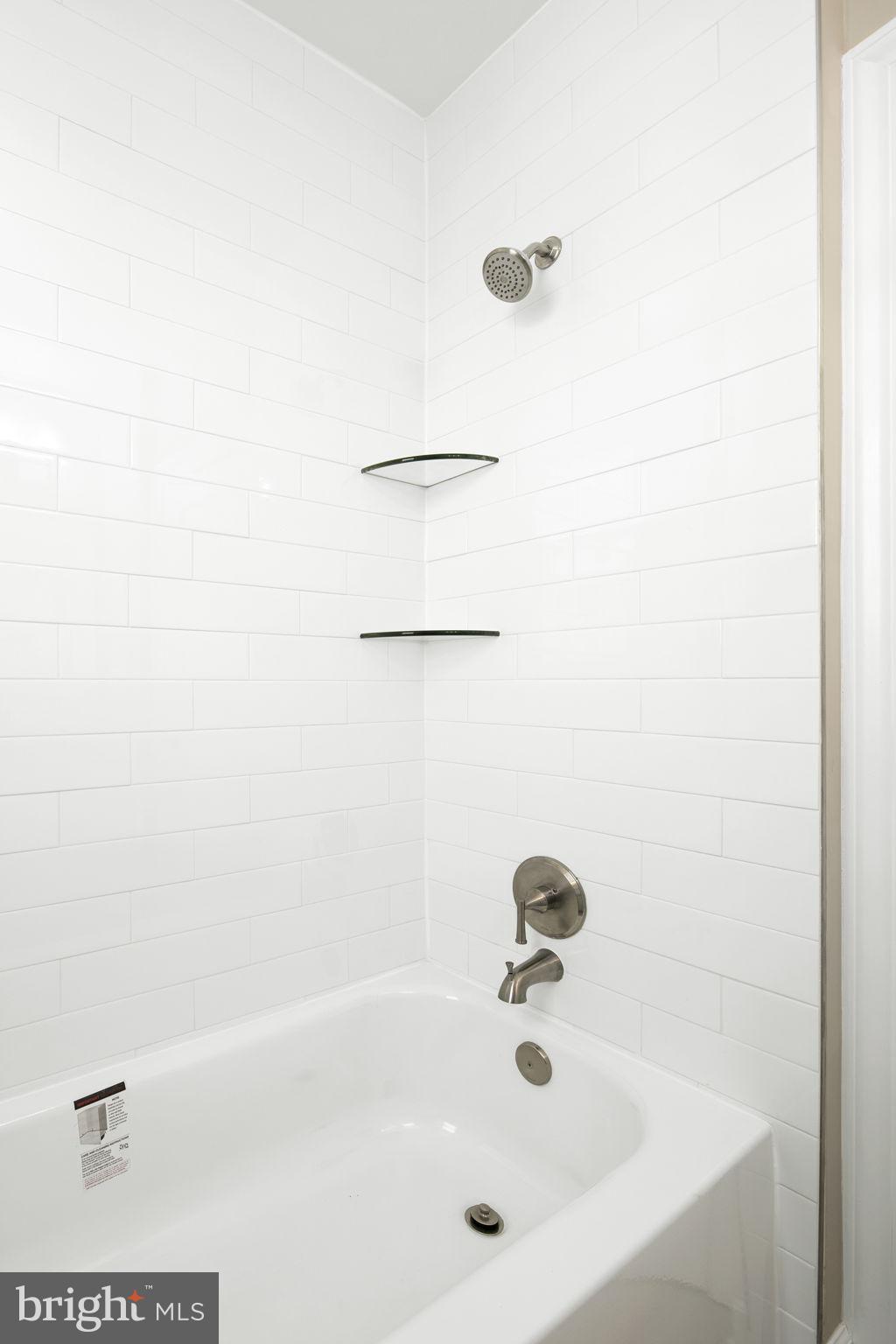 713 Rittenhouse Street Northwest Washington, DC 20011 - Photo 27 of 35 a bathroom with a bathtub