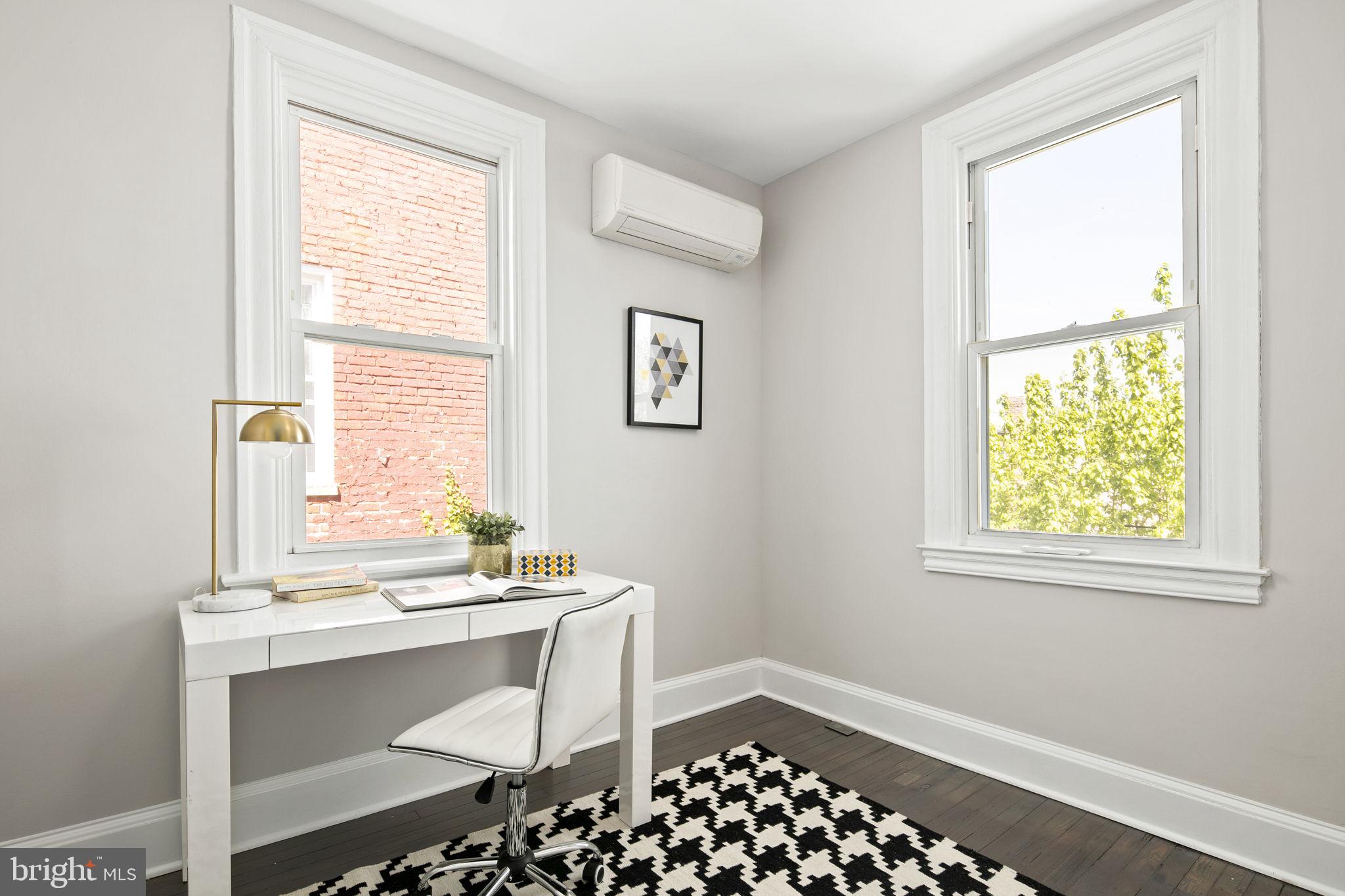 713 Rittenhouse Street Northwest Washington, DC 20011 - Photo 28 of 35 a room with a window and a table