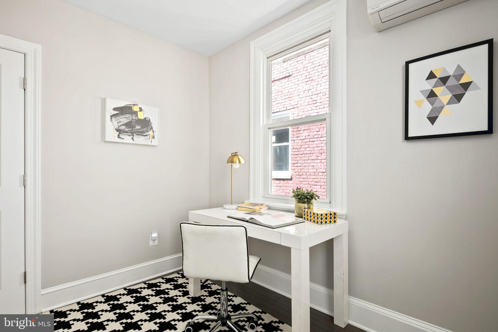 713 Rittenhouse Street Northwest Washington, DC 20011 - Photo 29 of 35 a bathroom with a sink a toilet and a window