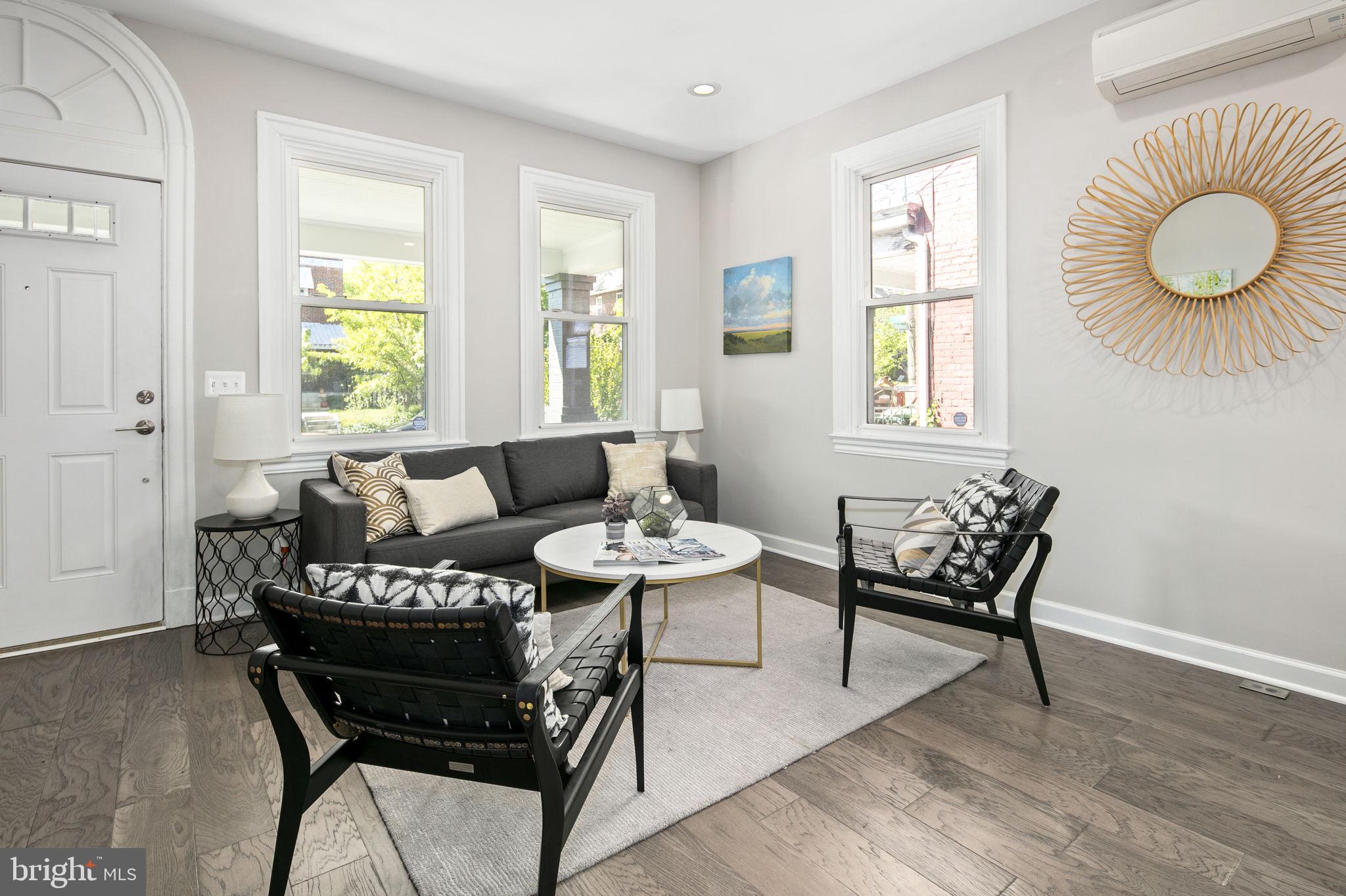 713 Rittenhouse Street Northwest Washington, DC 20011 - Photo 3 of 35 a living room with furniture and a window