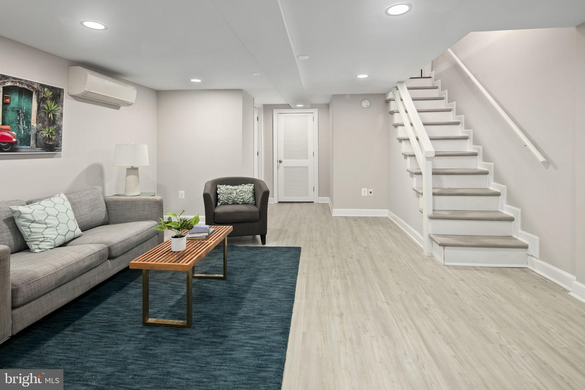 713 Rittenhouse Street Northwest Washington, DC 20011 - Photo 32 of 35 a living room with furniture and wooden floor