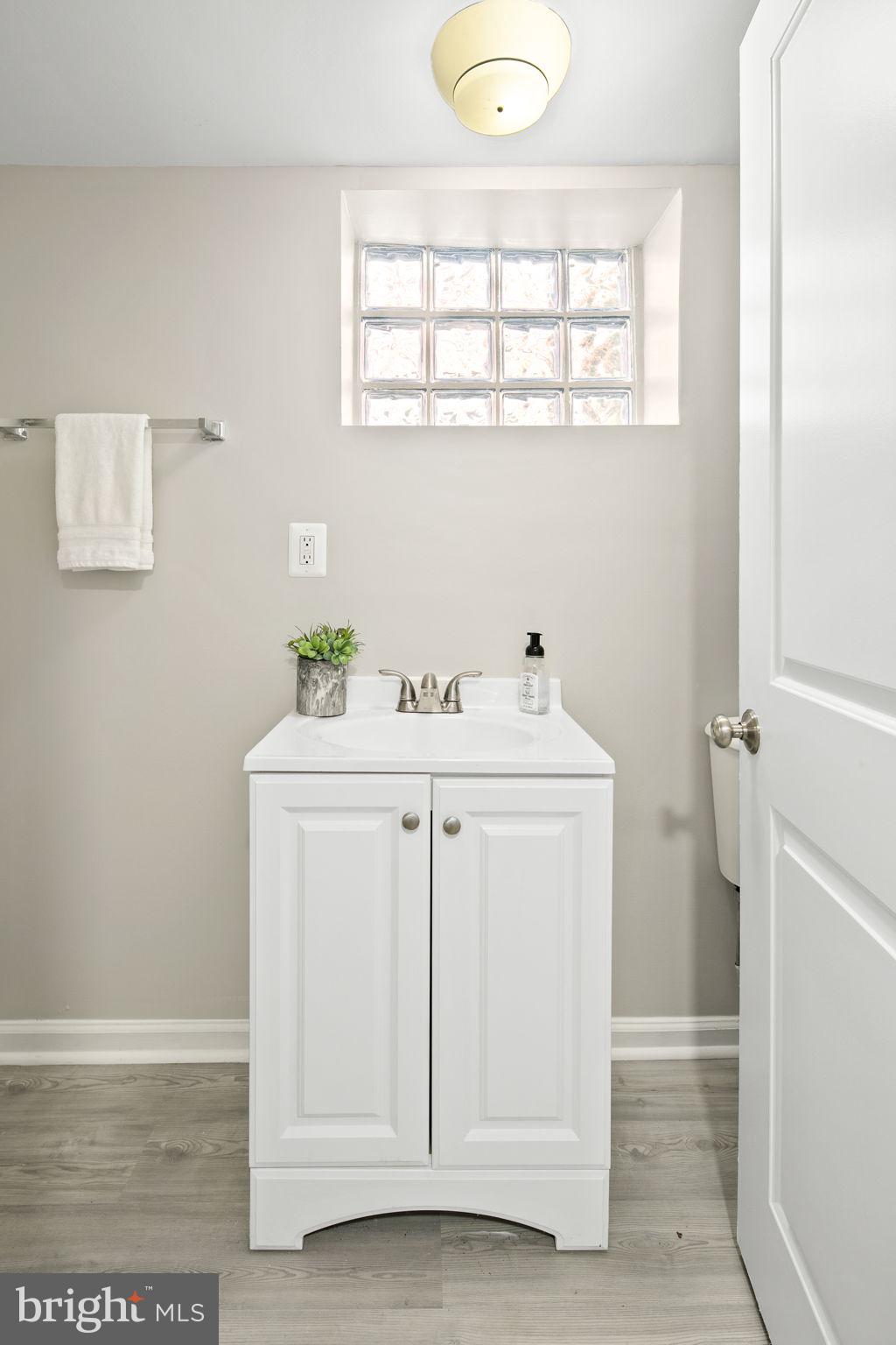 713 Rittenhouse Street Northwest Washington, DC 20011 - Photo 33 of 35 a utility room with a sink dryer and washer