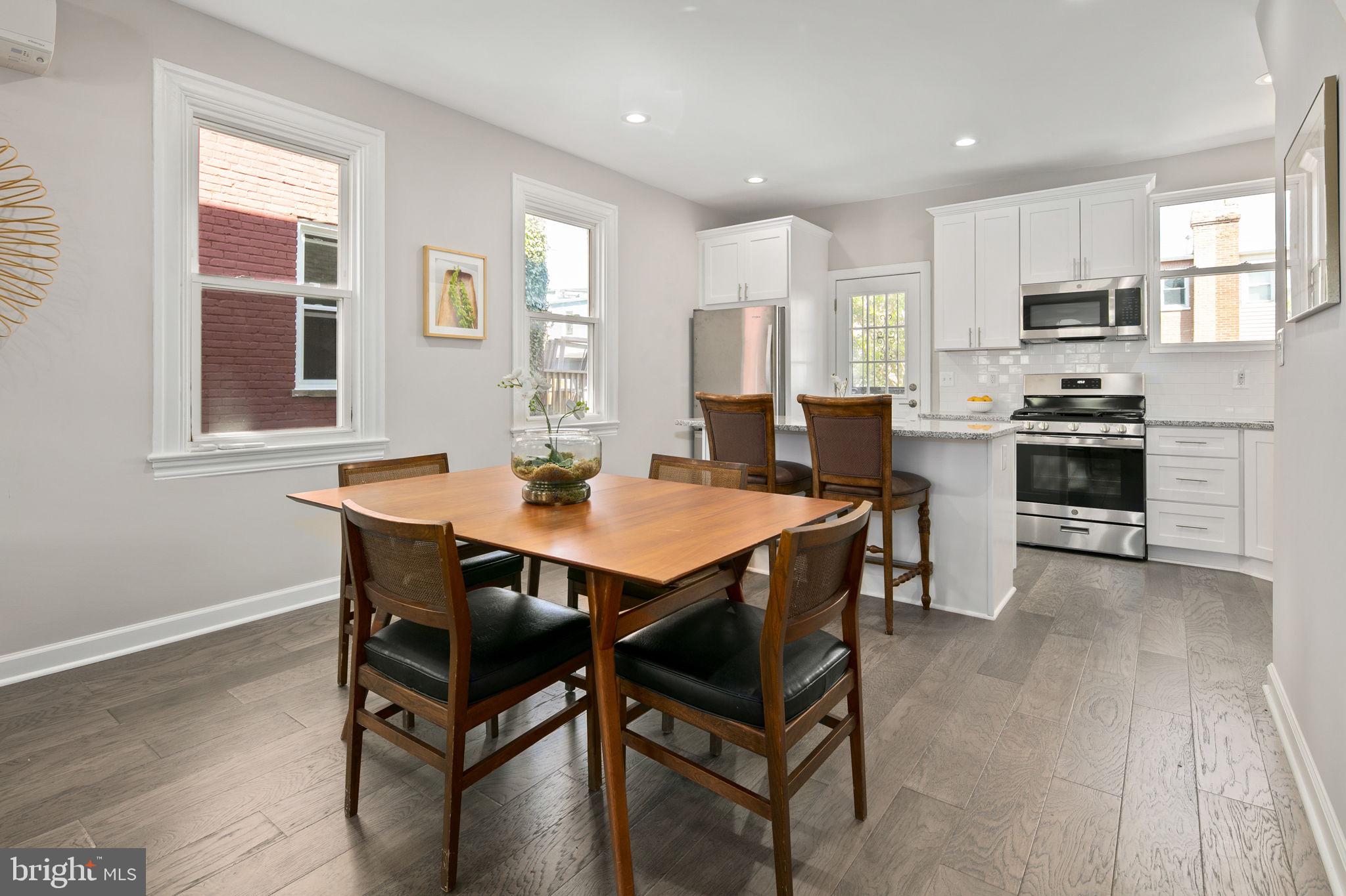 713 Rittenhouse Street Northwest Washington, DC 20011 - Photo 4 of 35 a view of a dining room with furniture and wooden floor