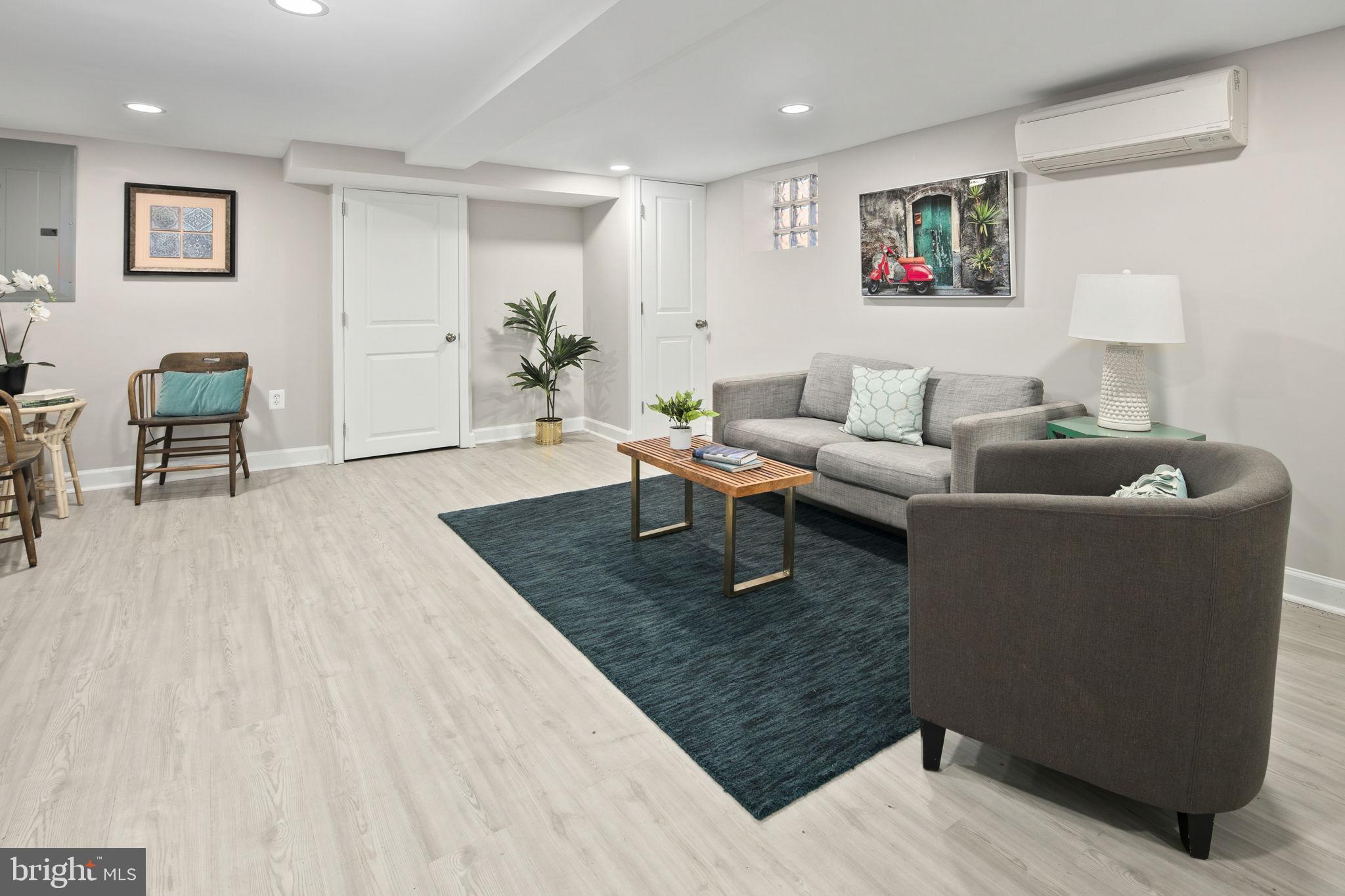 713 Rittenhouse Street Northwest Washington, DC 20011 - Photo 8 of 35 a living room with furniture and a wooden floor