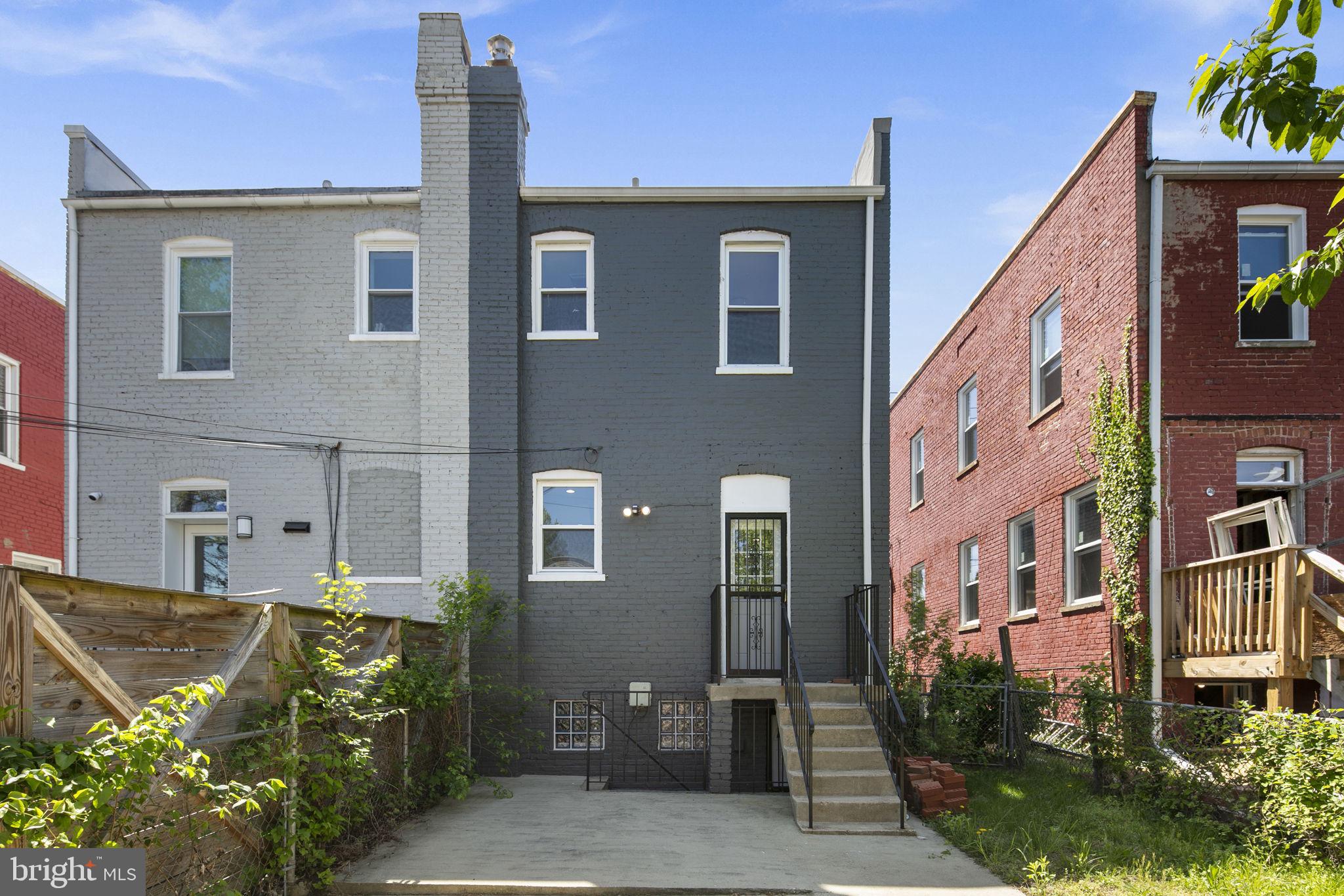 713 Rittenhouse Street Northwest Washington, DC 20011 - Photo 9 of 35 a front view of a house with parking