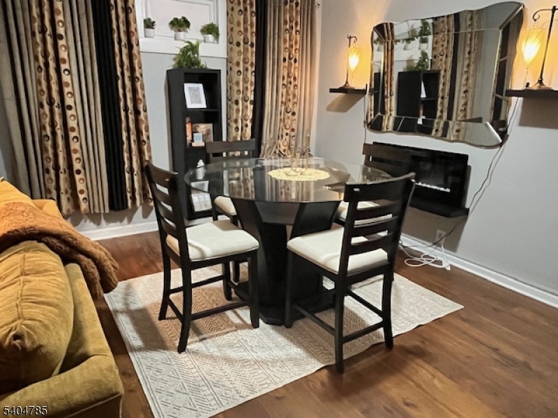 42 Harding Terrace Newark, NJ 07112 - Photo 2 of 7 a view of a livingroom with furniture and wooden floor