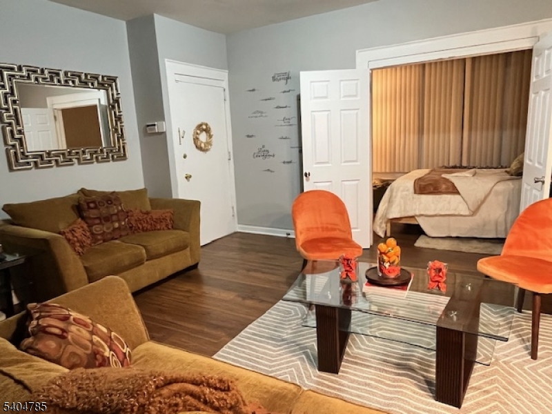 42 Harding Terrace Newark, NJ 07112 - Photo 3 of 7 a living room with furniture and wooden floor