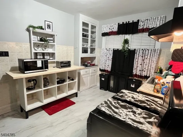 a bedroom with furniture closet and a window