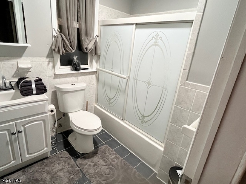 42 Harding Terrace Newark, NJ 07112 - Photo 7 of 7 a bathroom with a toilet a sink and a shower
