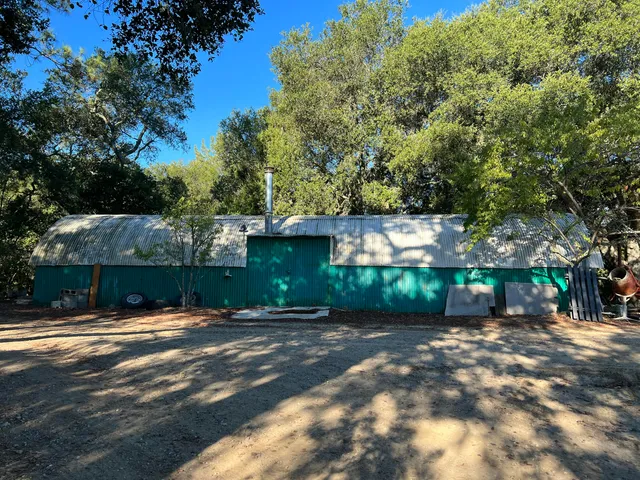 a view of a backyard of the house
