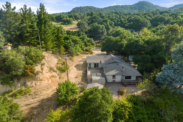 an aerial view of a house with mountain view