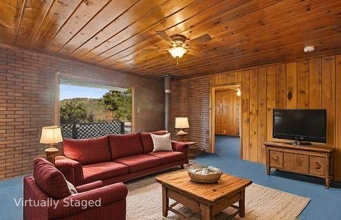 6572 Stagecoach Road Santa Barbara, CA 93105 - Photo 3 of 44 a living room with furniture and a flat screen tv