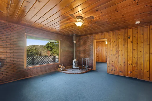 a view of an empty room with a fireplace
