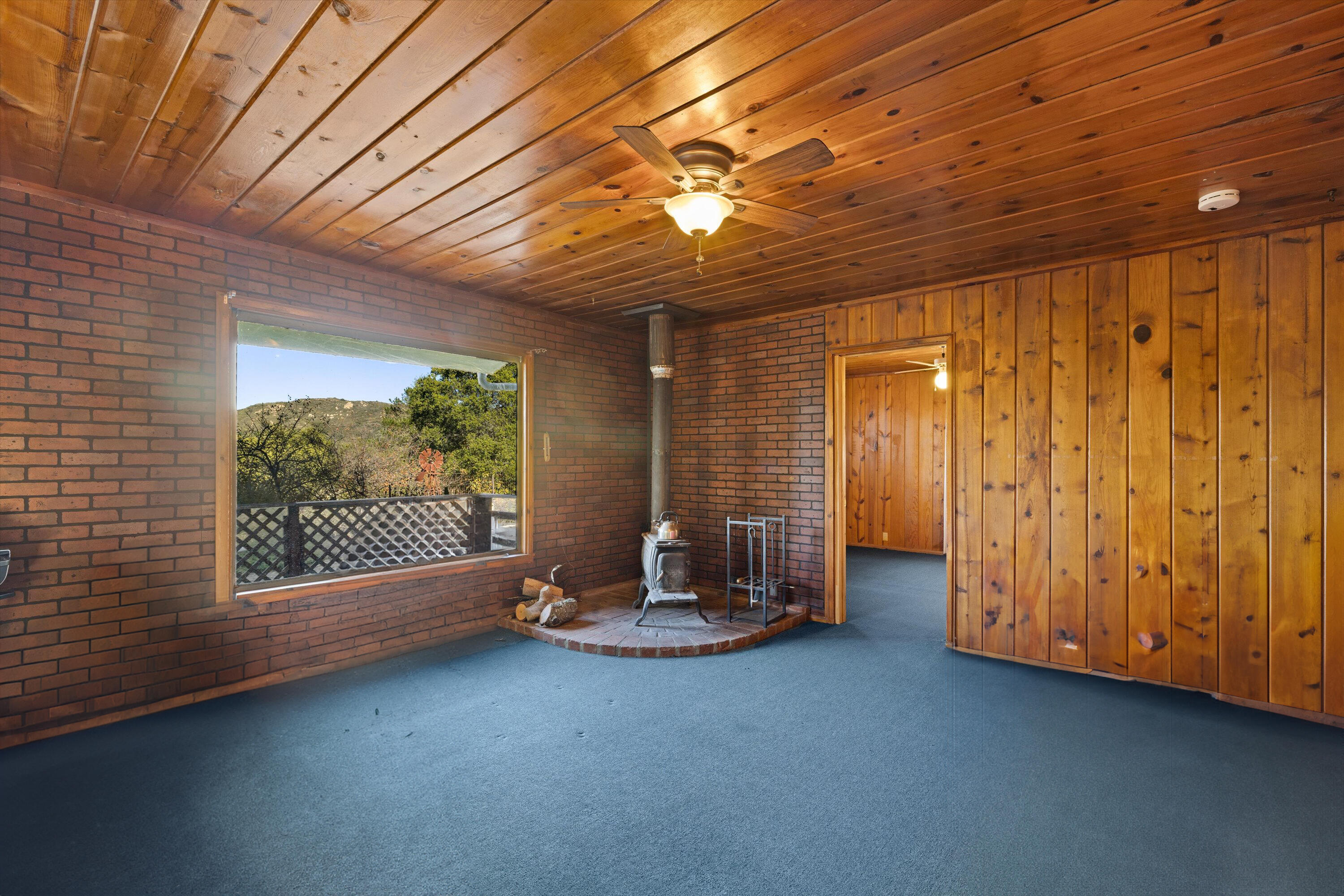 6572 Stagecoach Road Santa Barbara, CA 93105 - Photo 4 of 44 a view of an empty room with a fireplace