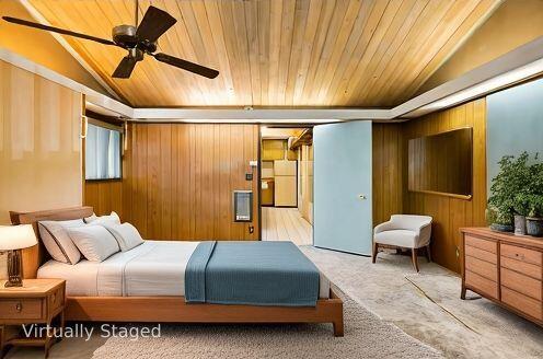 6572 Stagecoach Road Santa Barbara, CA 93105 - Photo 9 of 44 a bedroom with a bed and a chandelier