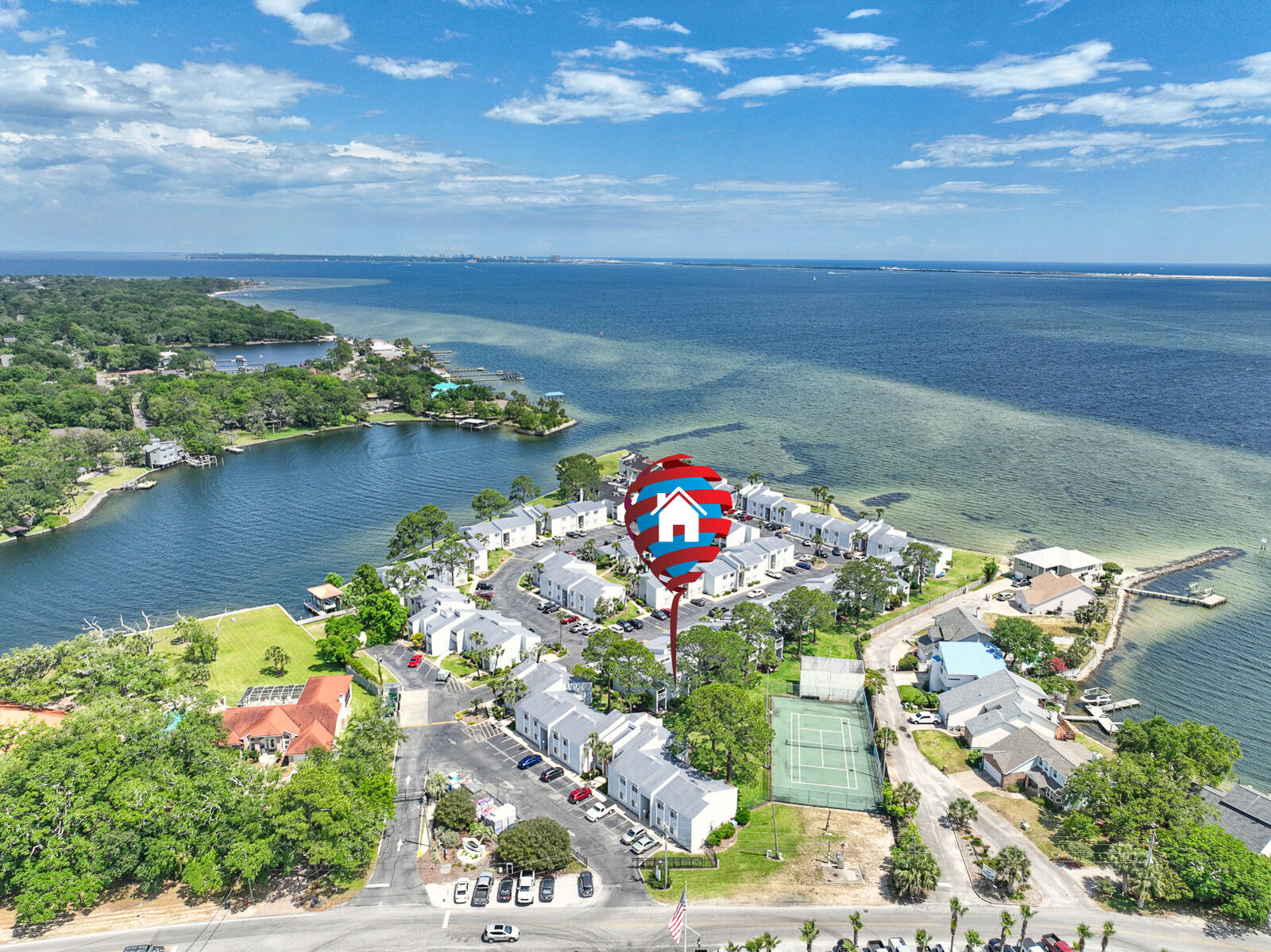 101 Old Ferry Road, Unit 5B Shalimar, FL 32579 - Photo 1 of 22 a view of a lake with a building in the background