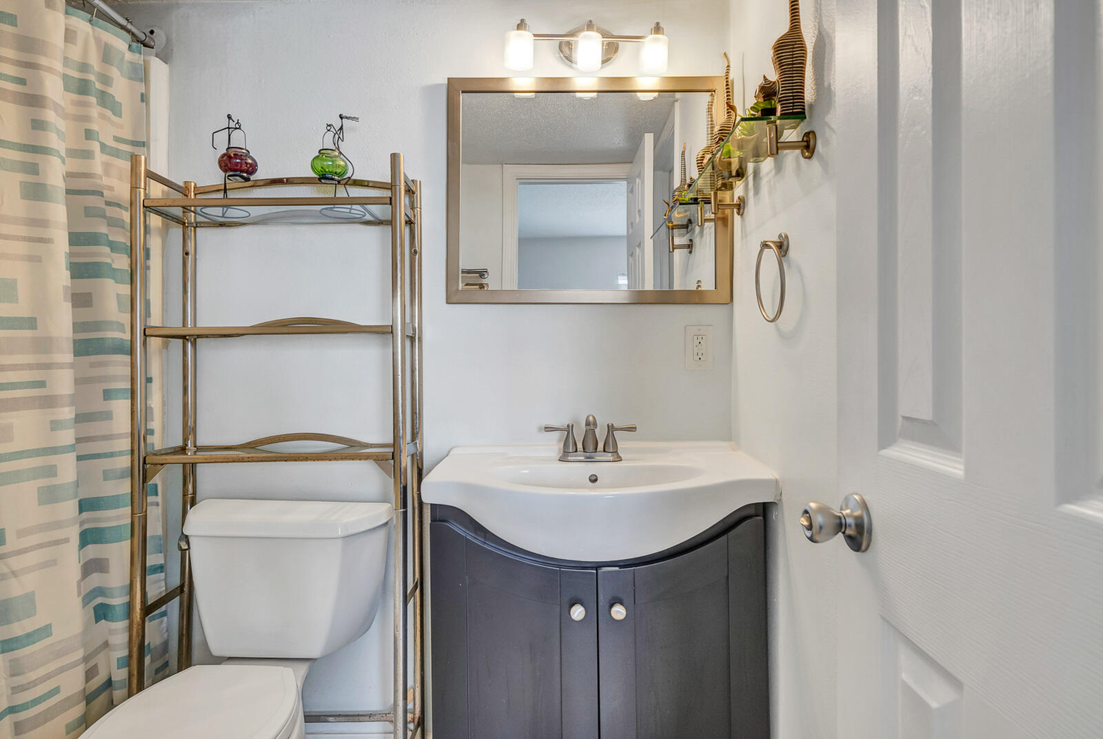 101 Old Ferry Road, Unit 5B Shalimar, FL 32579 - Photo 11 of 22 a bathroom with a sink toilet and mirror