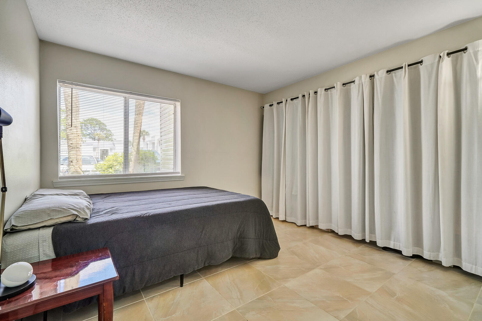 101 Old Ferry Road, Unit 5B Shalimar, FL 32579 - Photo 12 of 22 a spacious bedroom with a bed and a window