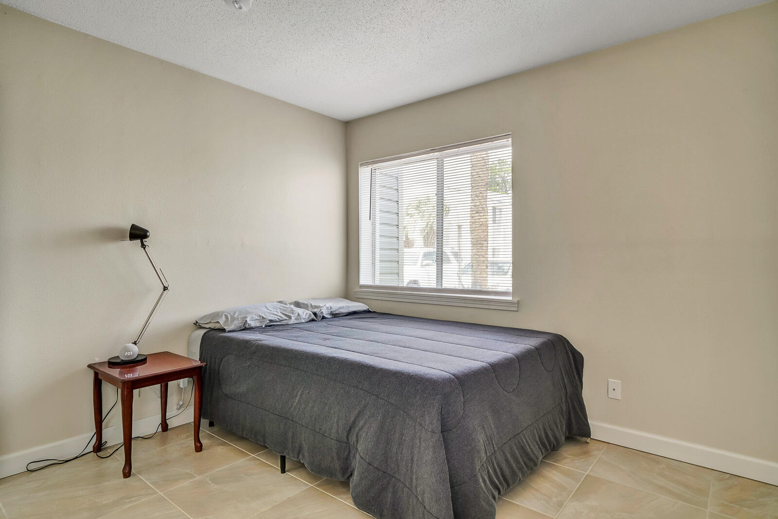 101 Old Ferry Road, Unit 5B Shalimar, FL 32579 - Photo 13 of 22 a bedroom with a bed and a window