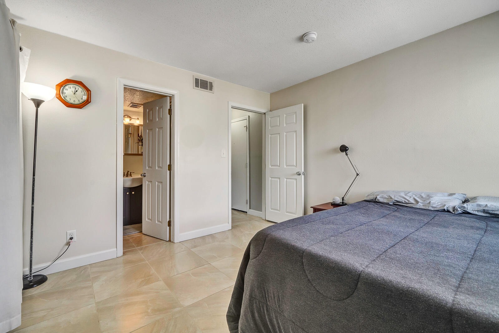 101 Old Ferry Road, Unit 5B Shalimar, FL 32579 - Photo 14 of 22 a bedroom with a bed and a cabinets