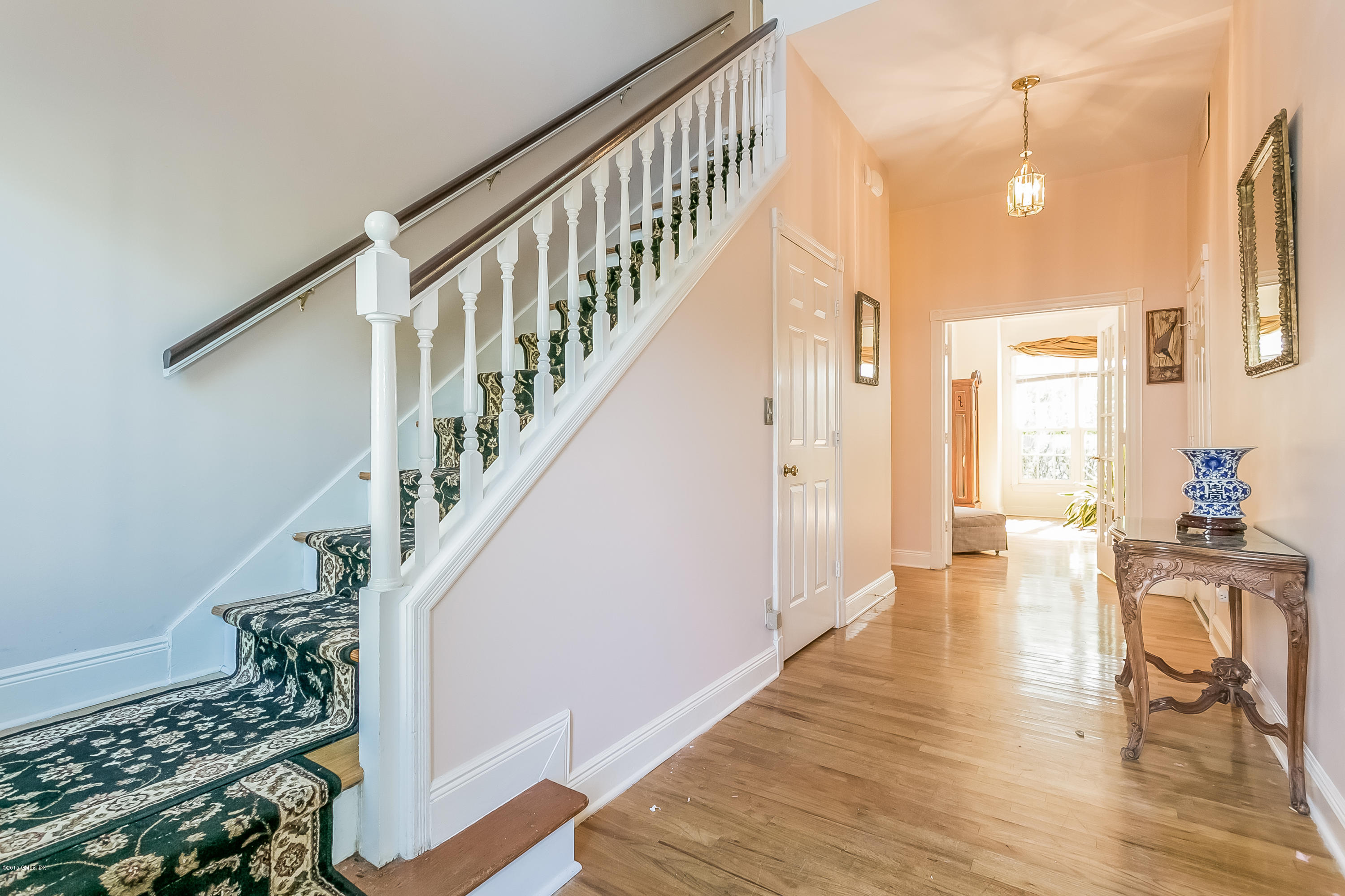 48 Spring Street, Unit 1 Greenwich, CT 06830 - Photo 3 of 18 a view of entryway and hall with wooden floor