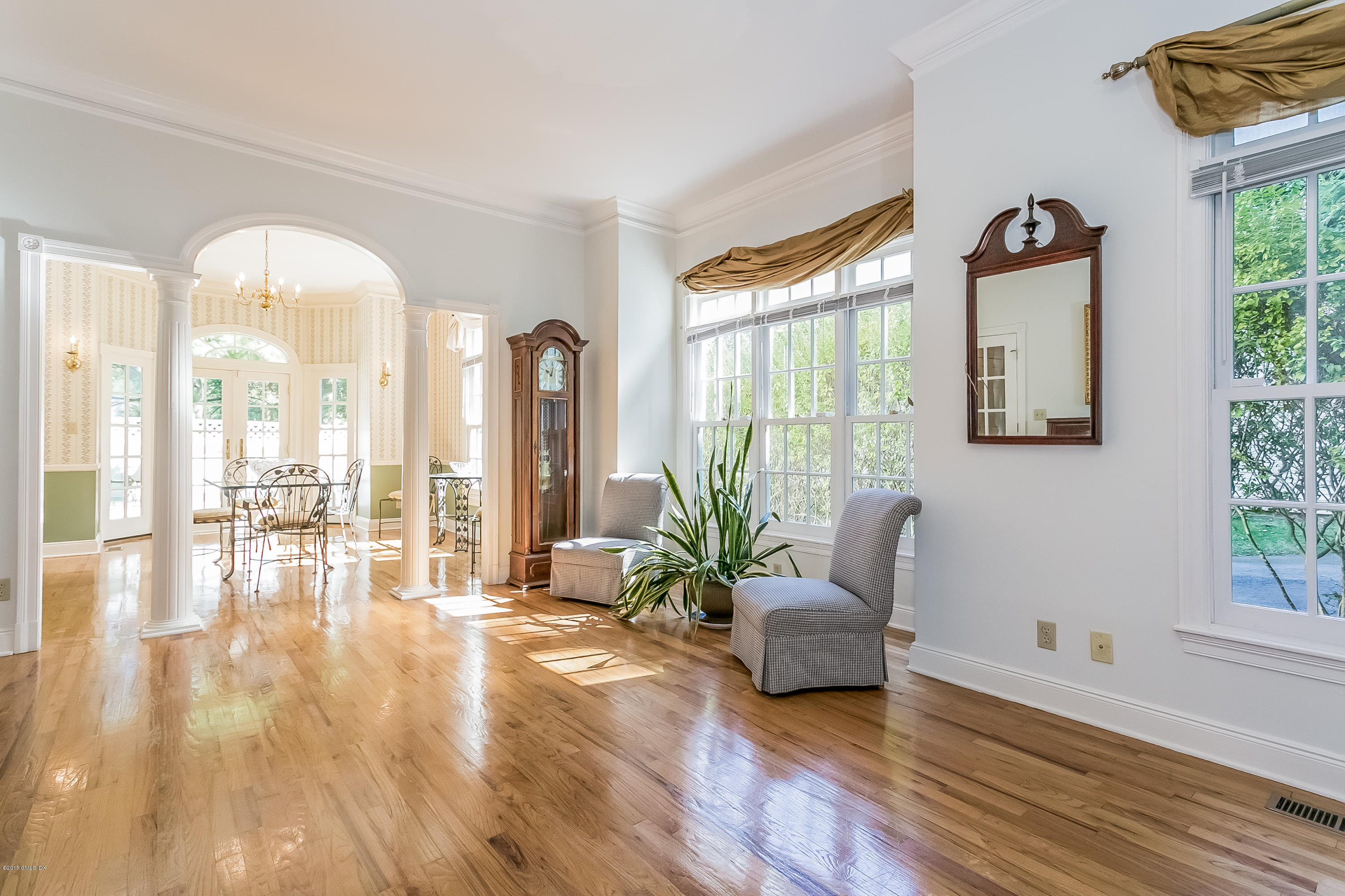 48 Spring Street, Unit 1 Greenwich, CT 06830 - Photo 4 of 18 a living room with furniture and a large window