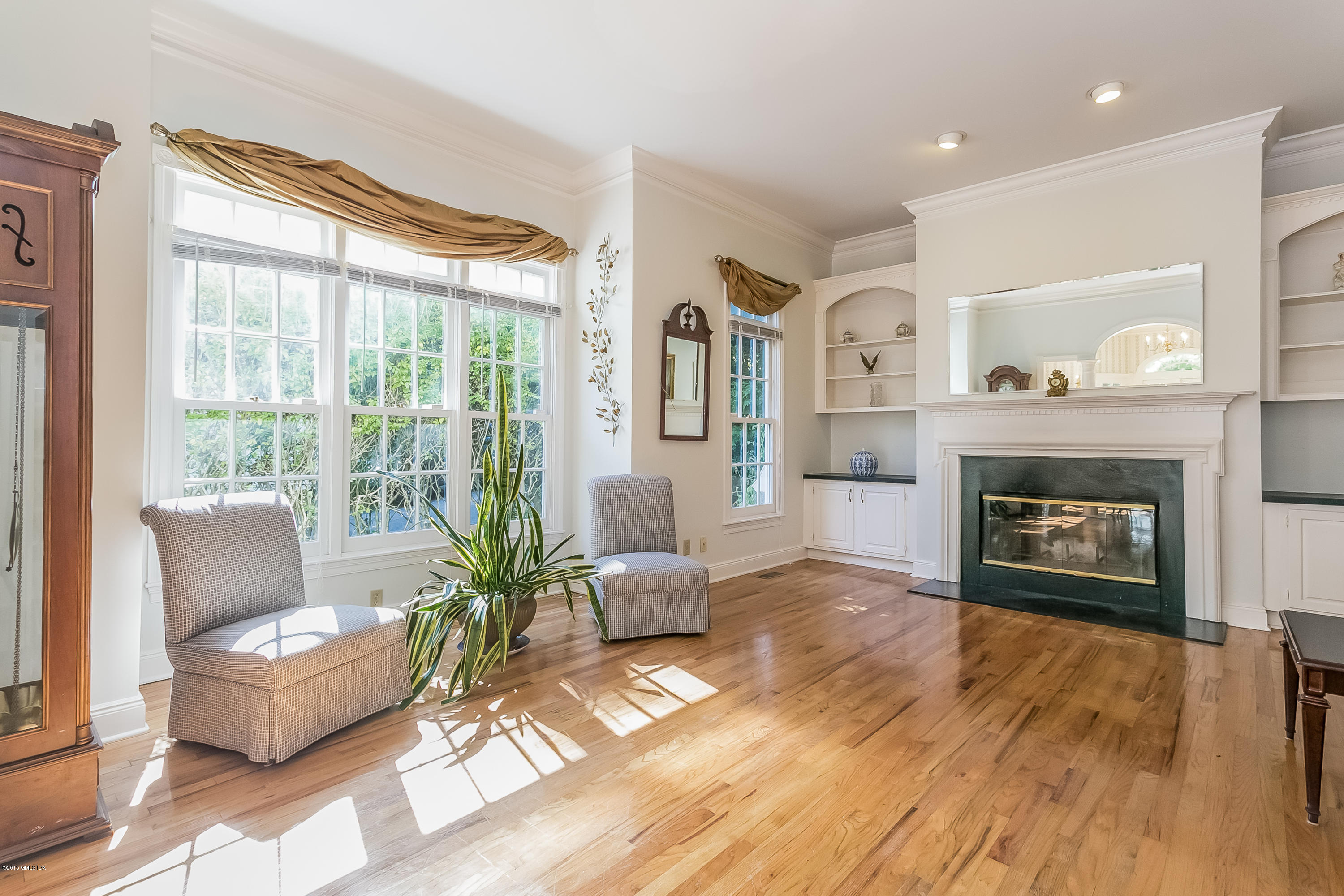 48 Spring Street, Unit 1 Greenwich, CT 06830 - Photo 5 of 18 a living room with furniture and a fireplace
