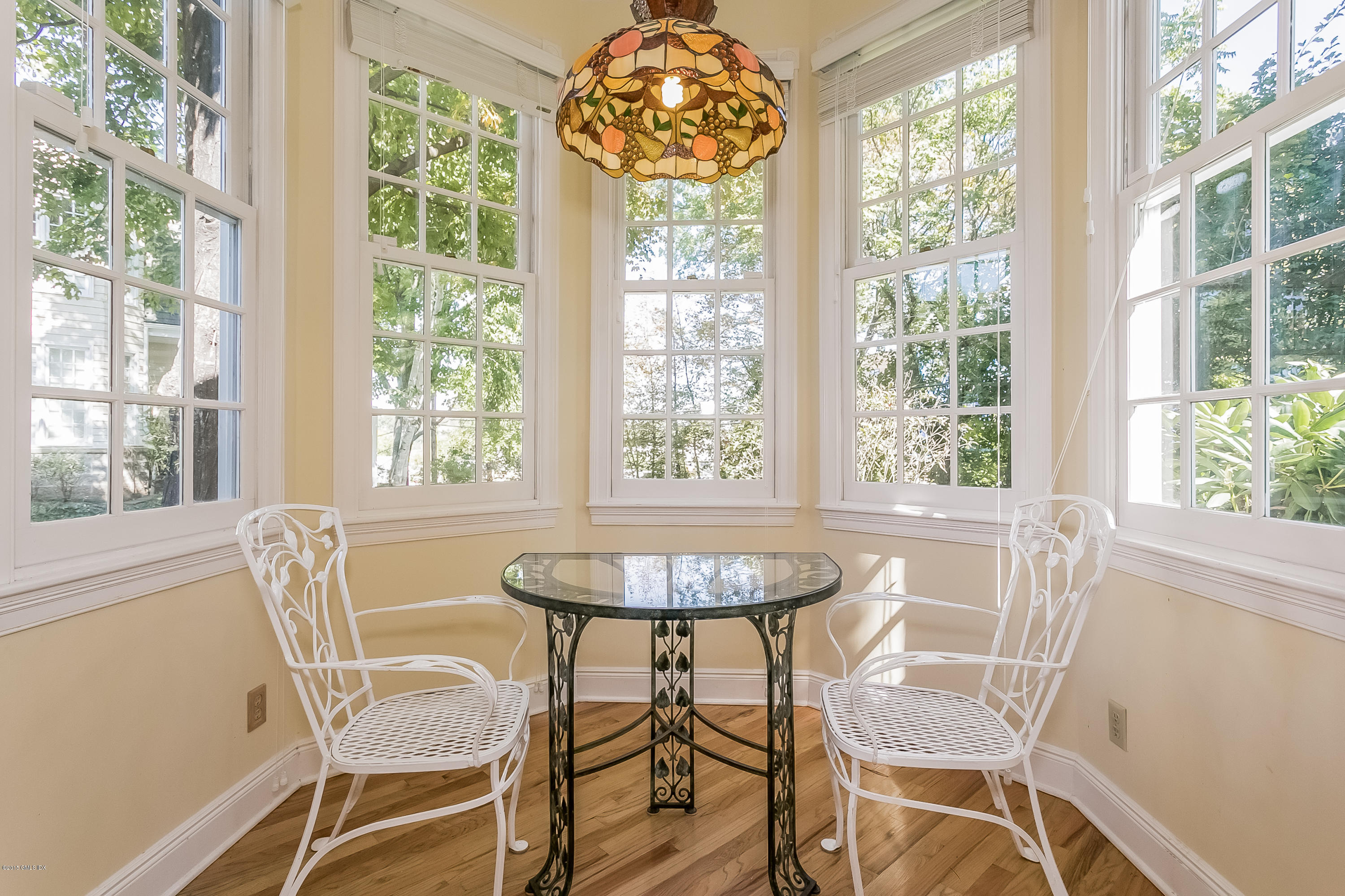 48 Spring Street, Unit 1 Greenwich, CT 06830 - Photo 10 of 18 a dining room with furniture and window