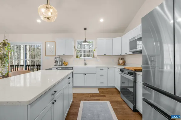 a kitchen with a sink stove and refrigerator