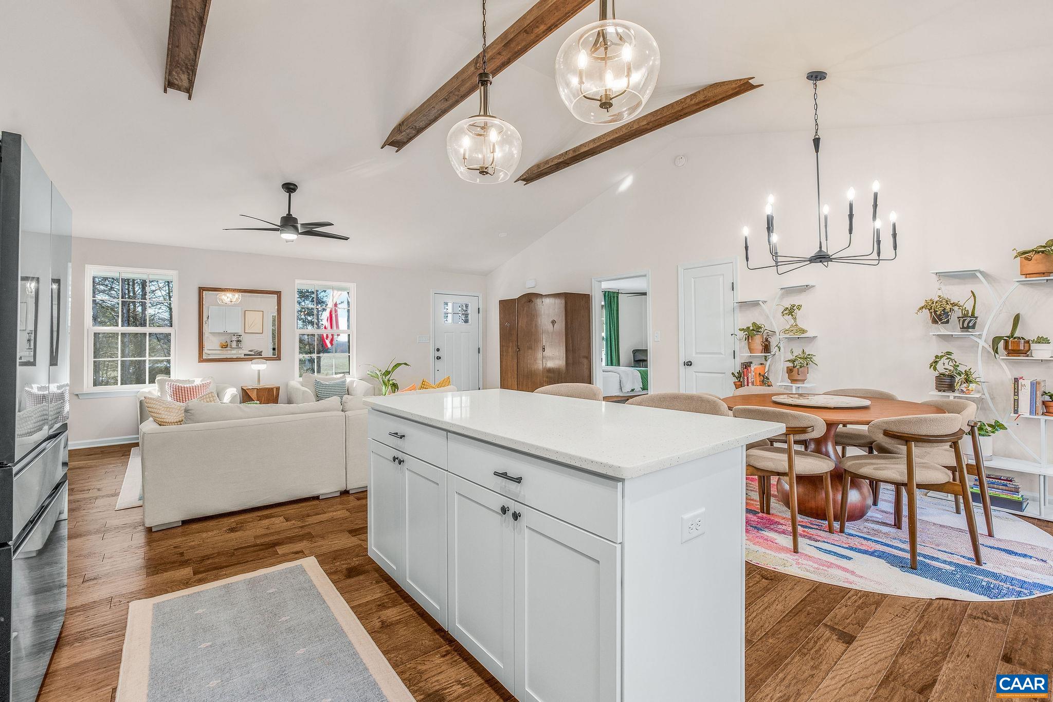 1229 Peach Grove Road Louisa, VA 23093 - Photo 16 of 47 a large white kitchen with sink and chairs