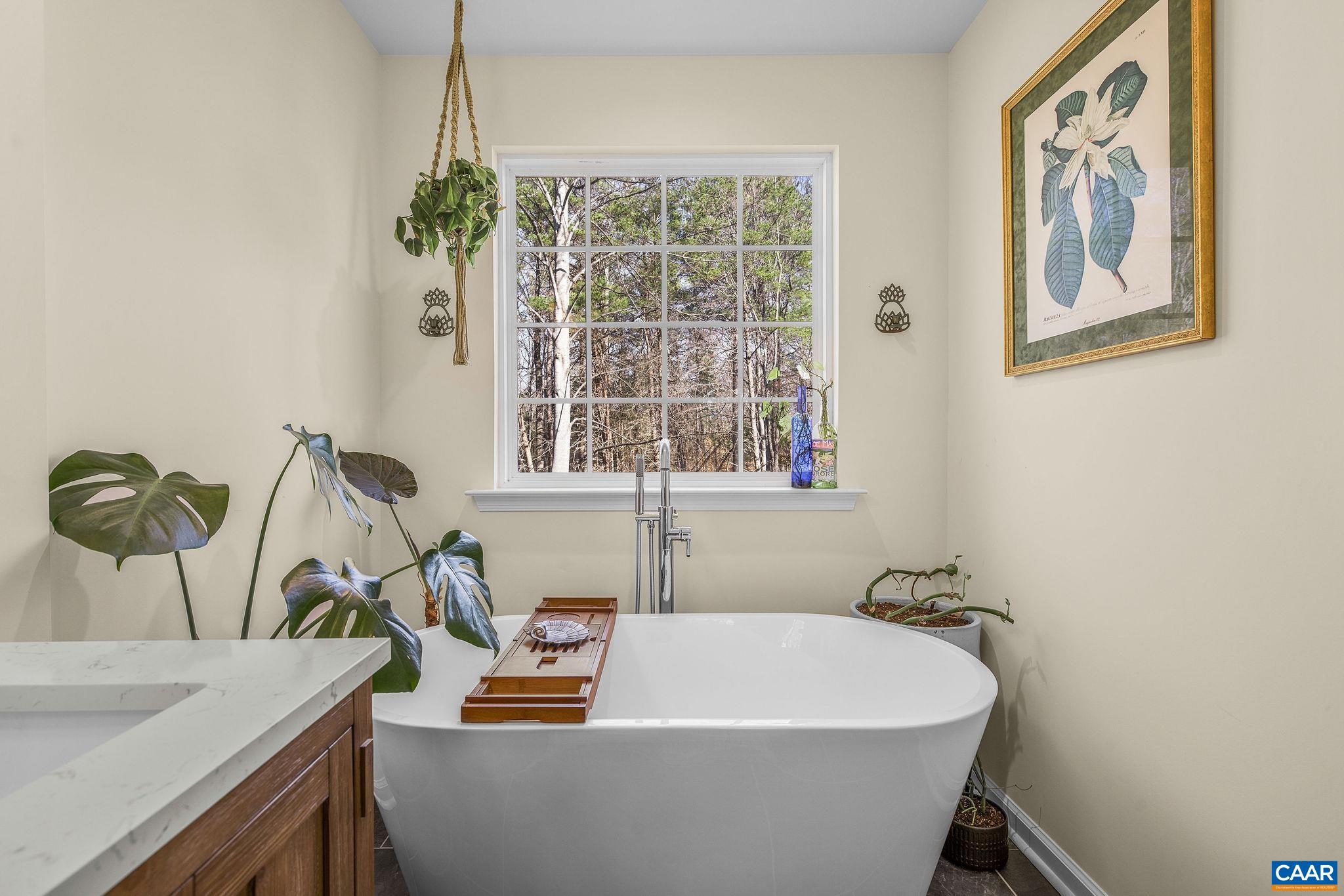 1229 Peach Grove Road Louisa, VA 23093 - Photo 23 of 47 a white bath tub sitting next to a window