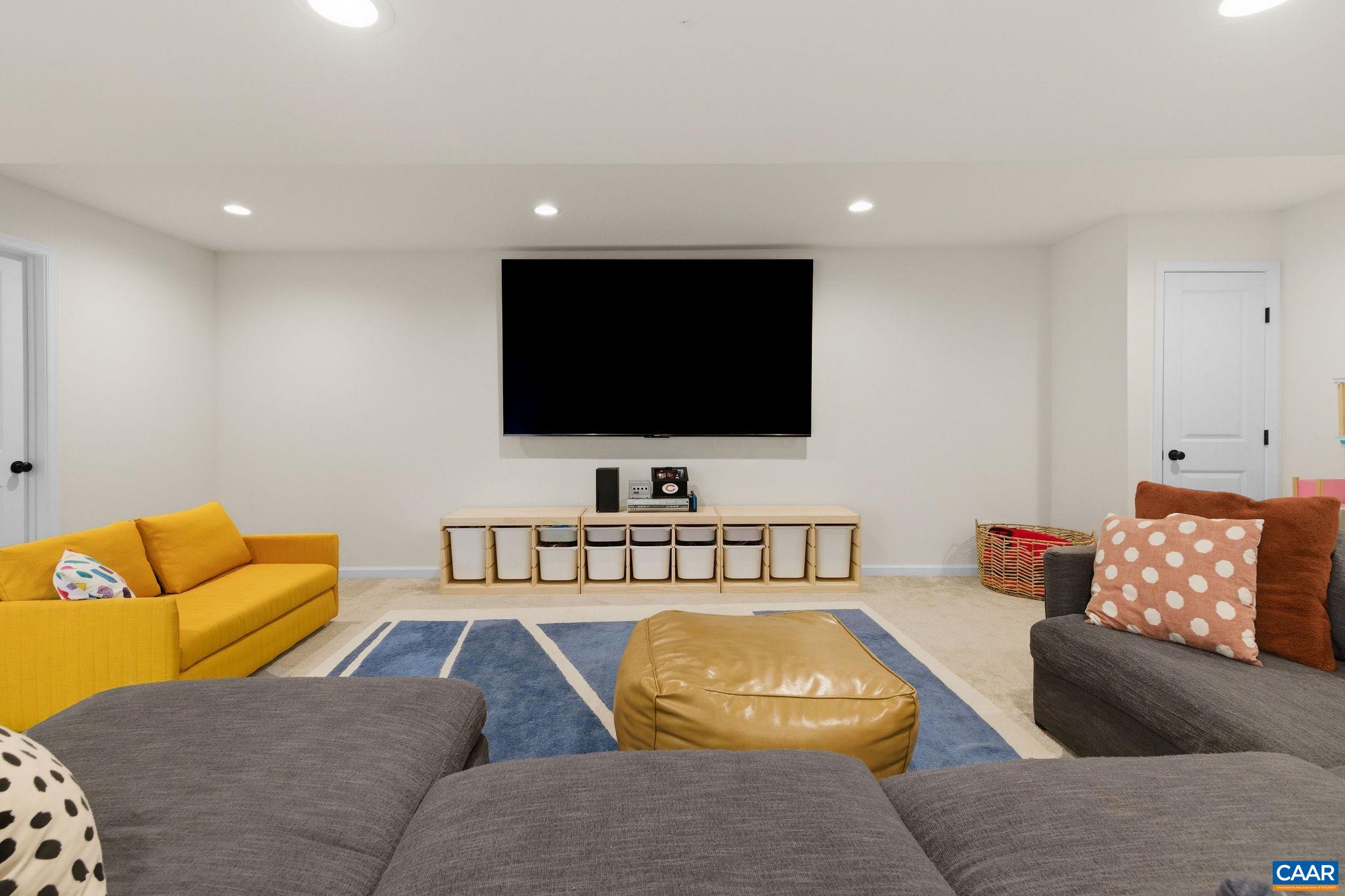1229 Peach Grove Road Louisa, VA 23093 - Photo 31 of 47 a living room with furniture and a flat screen tv