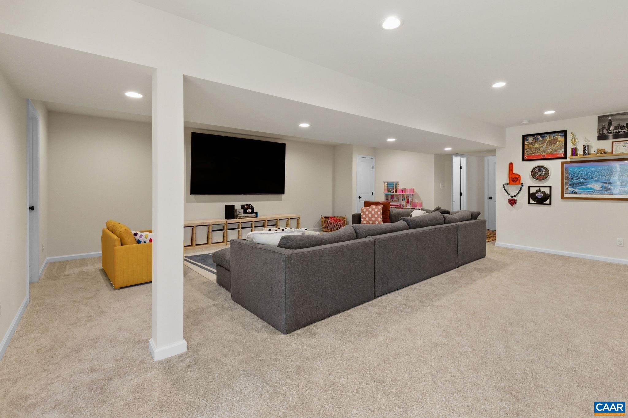 1229 Peach Grove Road Louisa, VA 23093 - Photo 32 of 47 a living room with furniture and a flat screen tv