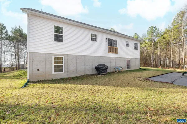 a view of a backyard of the house
