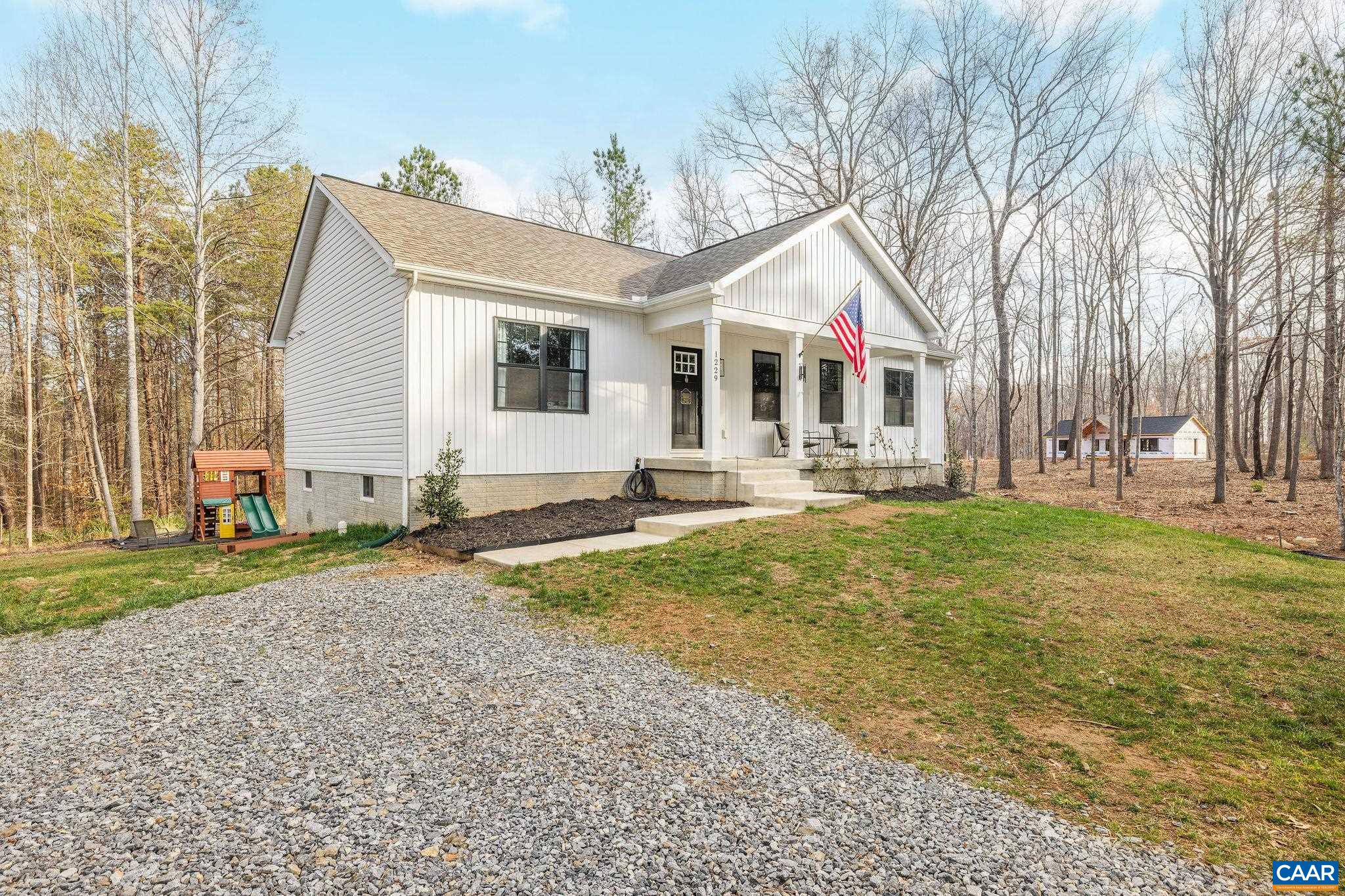 1229 Peach Grove Road Louisa, VA 23093 - Photo 45 of 47 a front view of house with yard and trees around