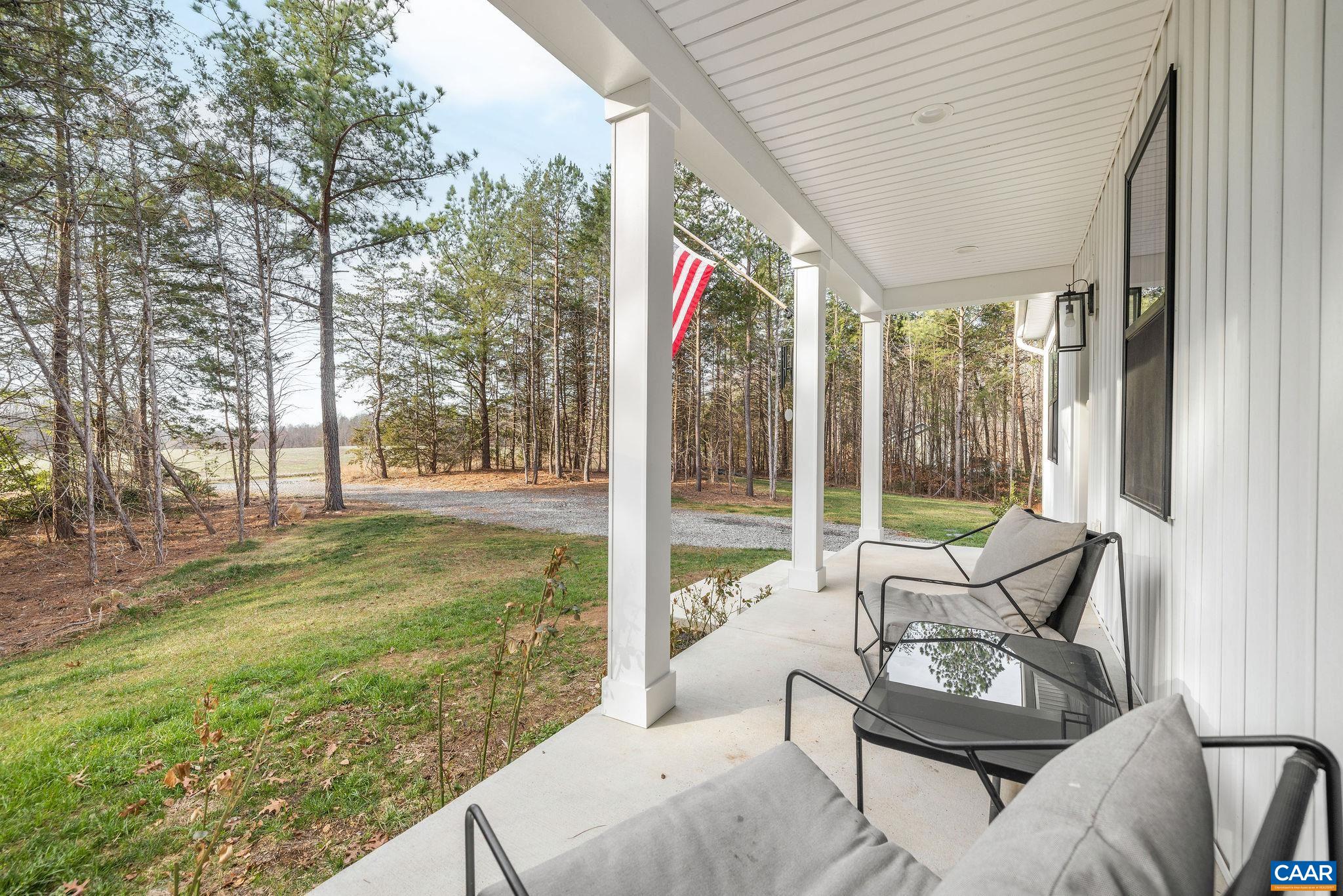 1229 Peach Grove Road Louisa, VA 23093 - Photo 5 of 47 a building outdoor space with patio furniture and garden