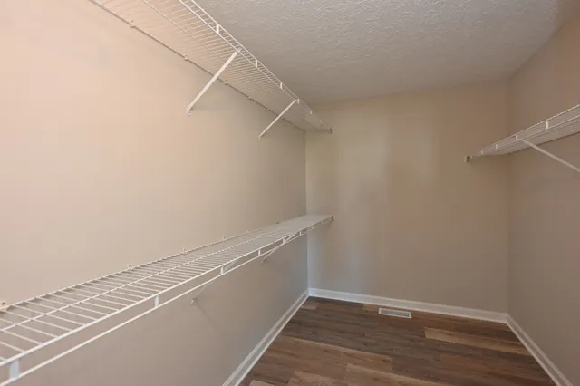 a view of an empty walk in closet