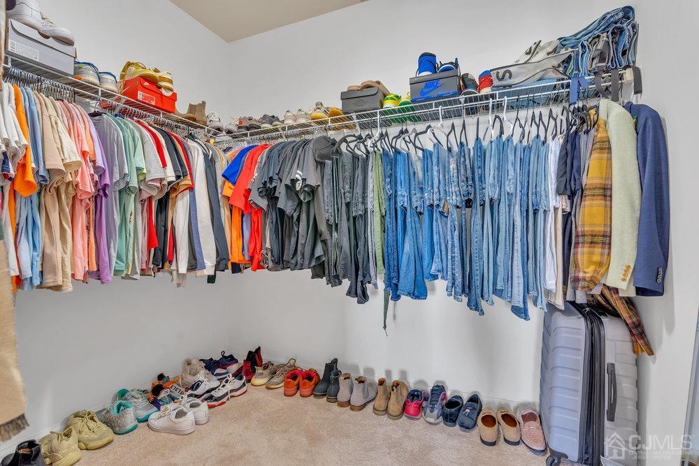 368 Rector Street, Unit 508 Perth Amboy, NJ 08861 - Photo 15 of 34 a view of walk in closet with clothes