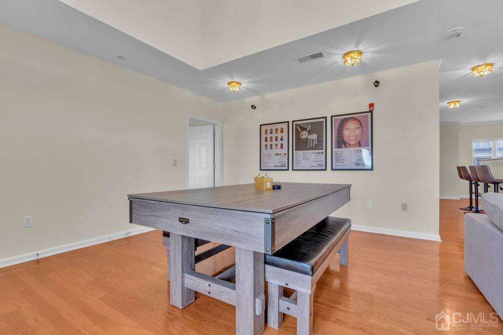 368 Rector Street, Unit 508 Perth Amboy, NJ 08861 - Photo 21 of 34 a room with table and painting on the wall