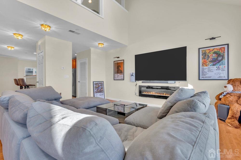 368 Rector Street, Unit 508 Perth Amboy, NJ 08861 - Photo 22 of 34 a living room with furniture and a flat screen tv