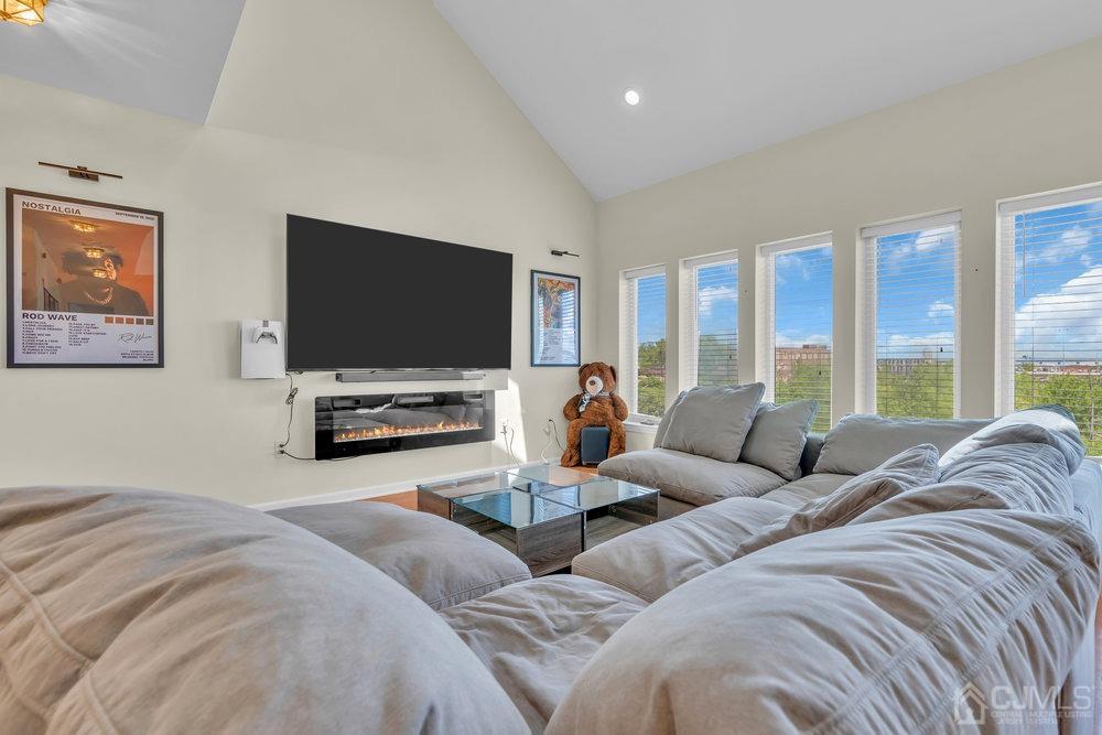 368 Rector Street, Unit 508 Perth Amboy, NJ 08861 - Photo 23 of 34 a living room with couches and a flat screen tv