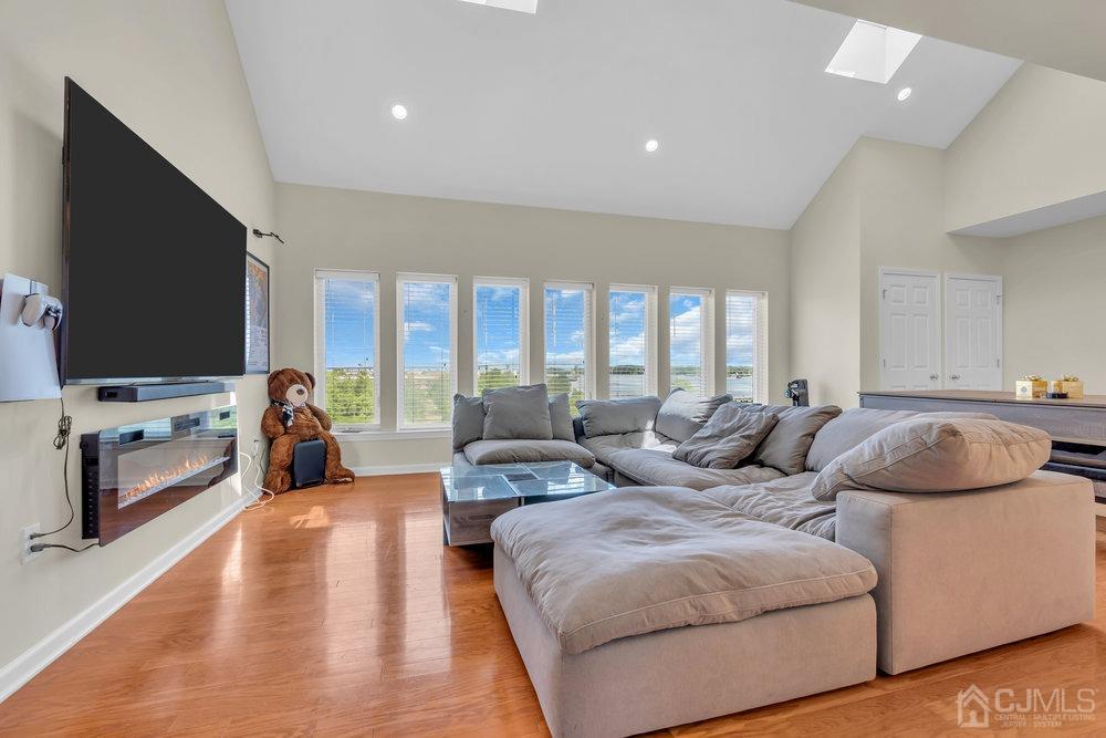 368 Rector Street, Unit 508 Perth Amboy, NJ 08861 - Photo 25 of 34 a living room with furniture and a flat screen tv