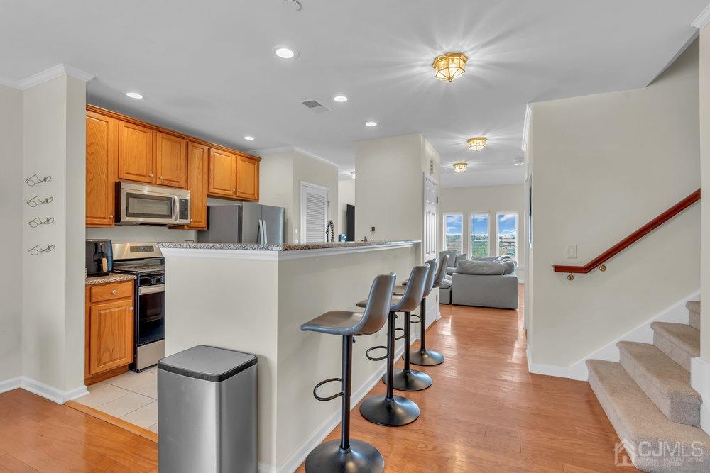 368 Rector Street, Unit 508 Perth Amboy, NJ 08861 - Photo 27 of 34 a view of kitchen with furniture and a refrigerator