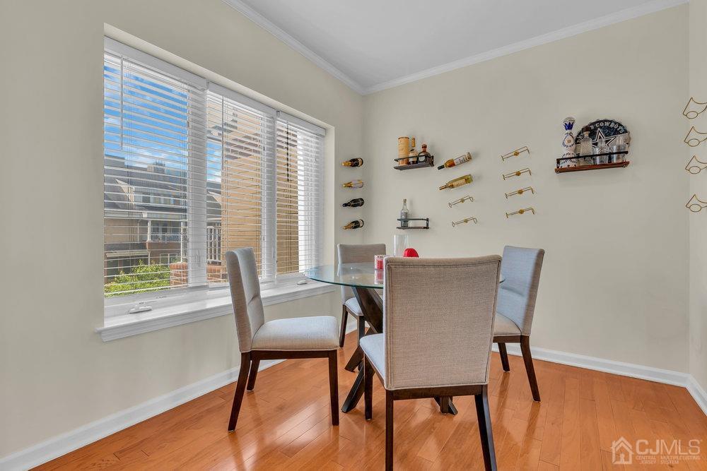 368 Rector Street, Unit 508 Perth Amboy, NJ 08861 - Photo 30 of 34 a view of a dining room with furniture and wooden floor